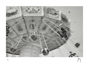 Merry-go-round carnival ride, motion blurred shot. | Fine Art Photographic print by Chad Henning